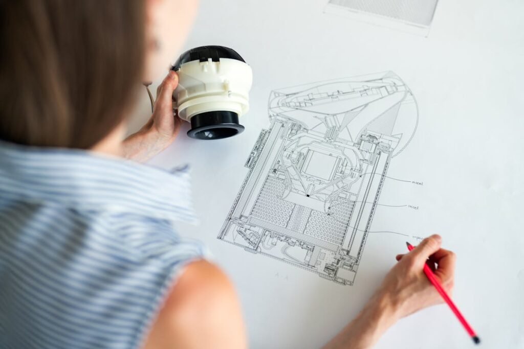 Engineer examining a mechanical blueprint of an exceptional home with a magnifying glass.