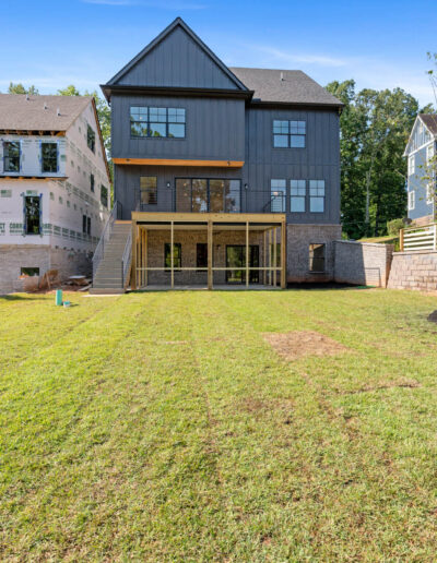 Backyard deck extension with modern railings