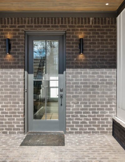 Grand entry with tall custom wood door